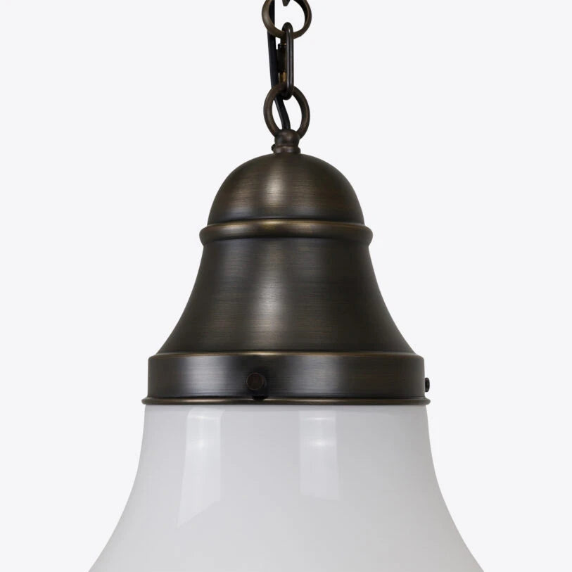 Bronze pendant light with white glass shade on a white background