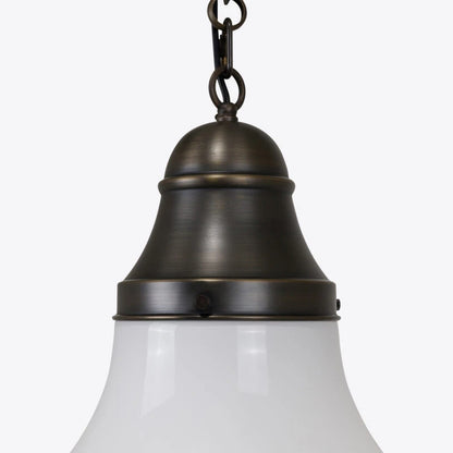 Bronze pendant light with white glass shade on a white background